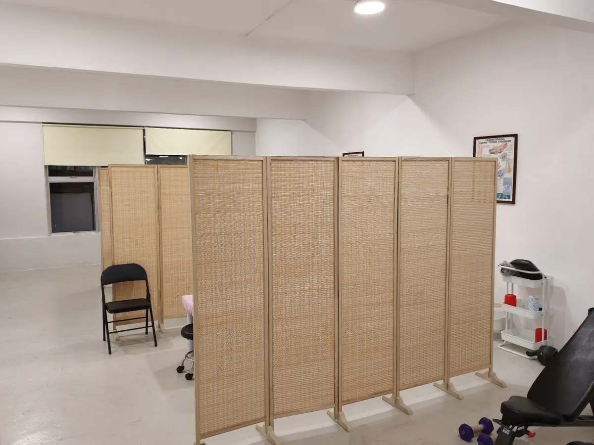 Treatment areas separated by privacy partitions at Armos Therapy