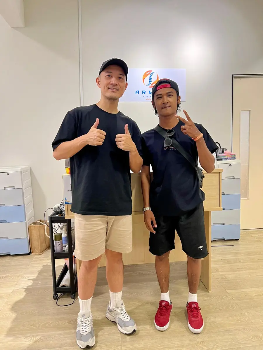 Winston with a member of the Armos community